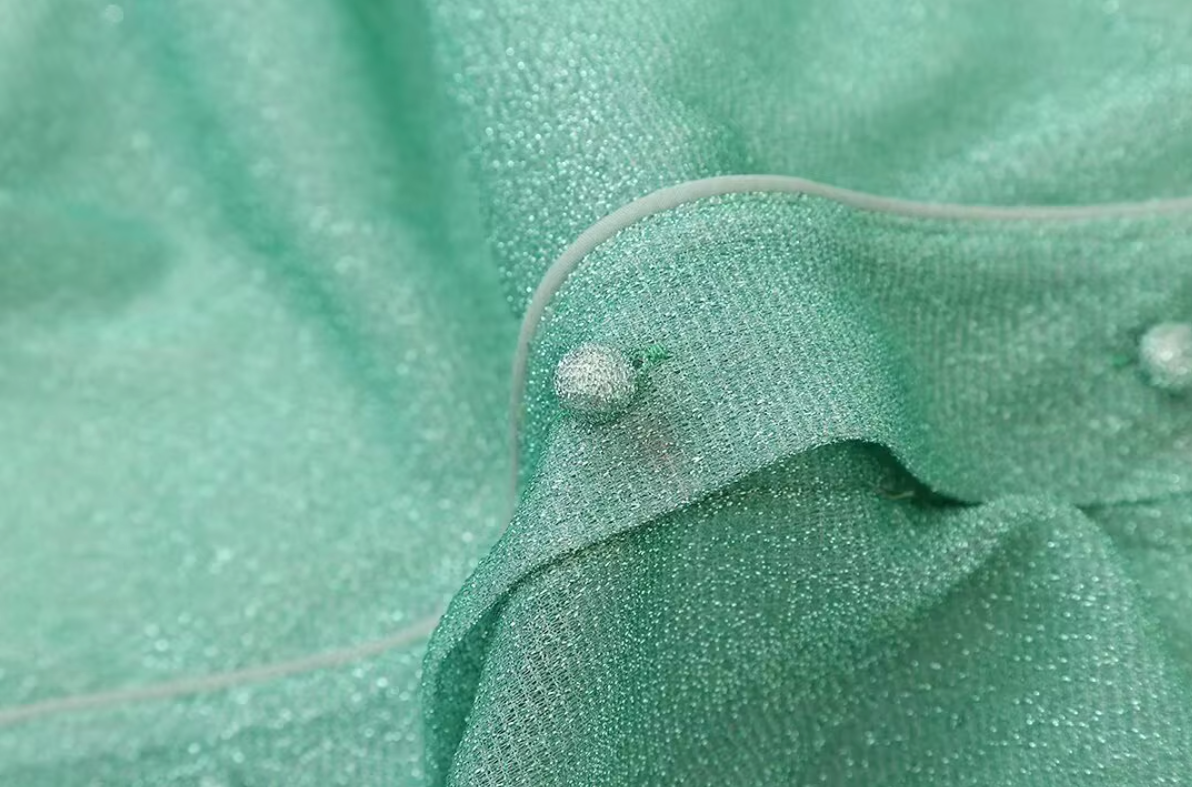 Turquoise shirt with feather cuffs