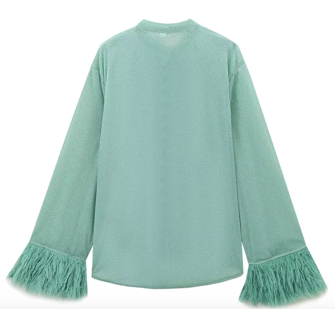 Turquoise shirt with feather cuffs